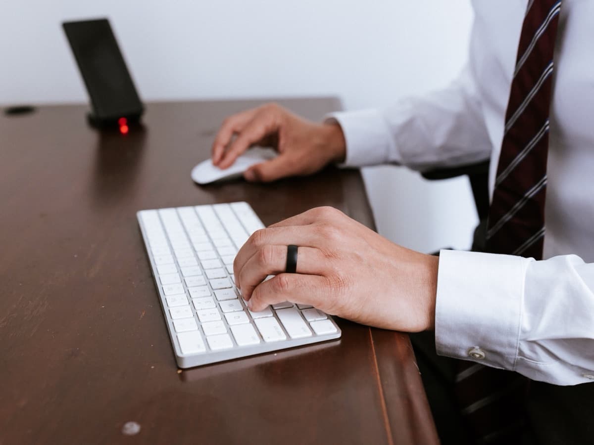 An attorney at Freundlich & Littman working at a desk keyboard while preparing a client's case