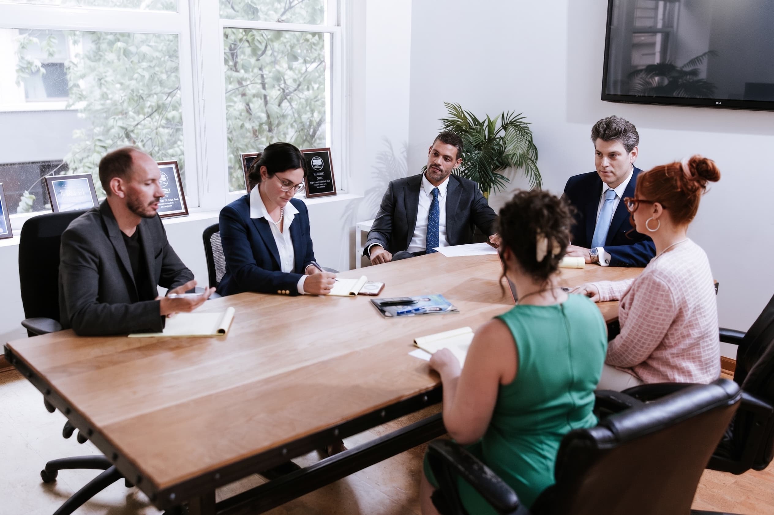 The Freundlich & Littman legal team reviewing a case together around the conference table at the firm's Philadelphia office